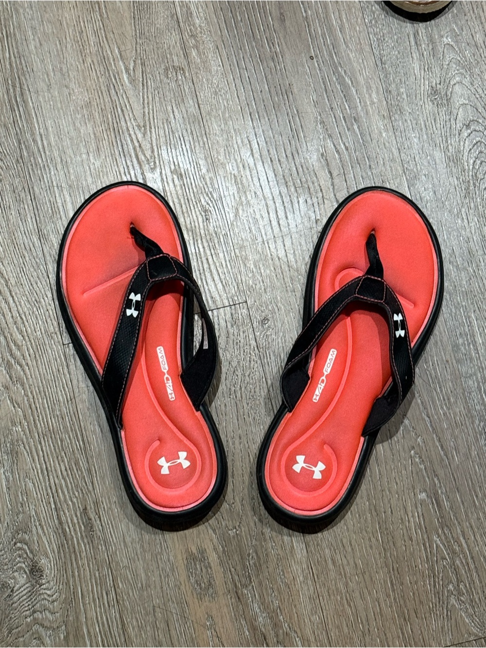 Under Armour Women’s Coral-Red and Black Cushioned Flip Flops